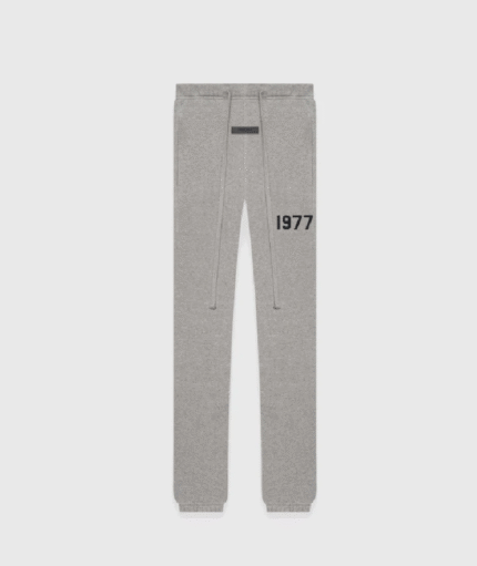 Grey sweatpants featuring the year "1977" printed on the leg.
