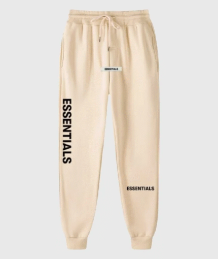 Beige sweatpants featuring the word "essentials" printed on the side.