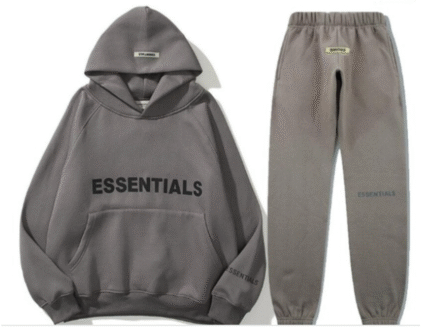 Grey sweatshirt and sweatpants set featuring the word "essentials" prominently displayed on the front.